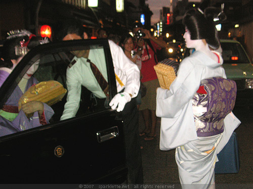 Geisha getting into cab at Gion in Kyoto