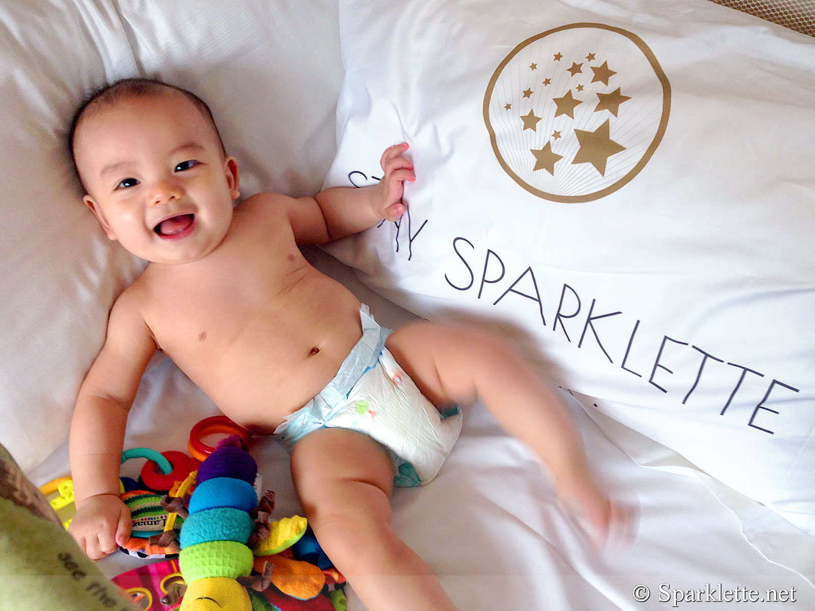 Baby Ethan with Park Hotel Clarke Quay pillow