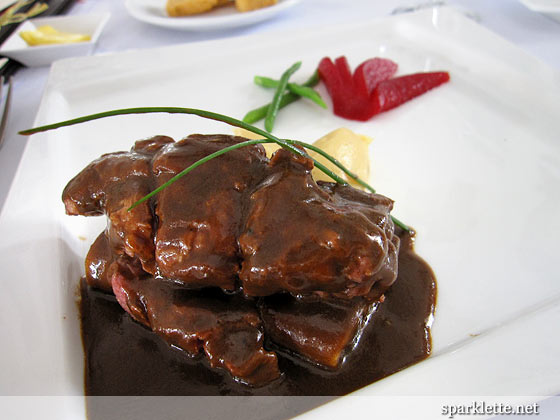 Braised Wagyu beef ribs with aged red wine jus & poached pear